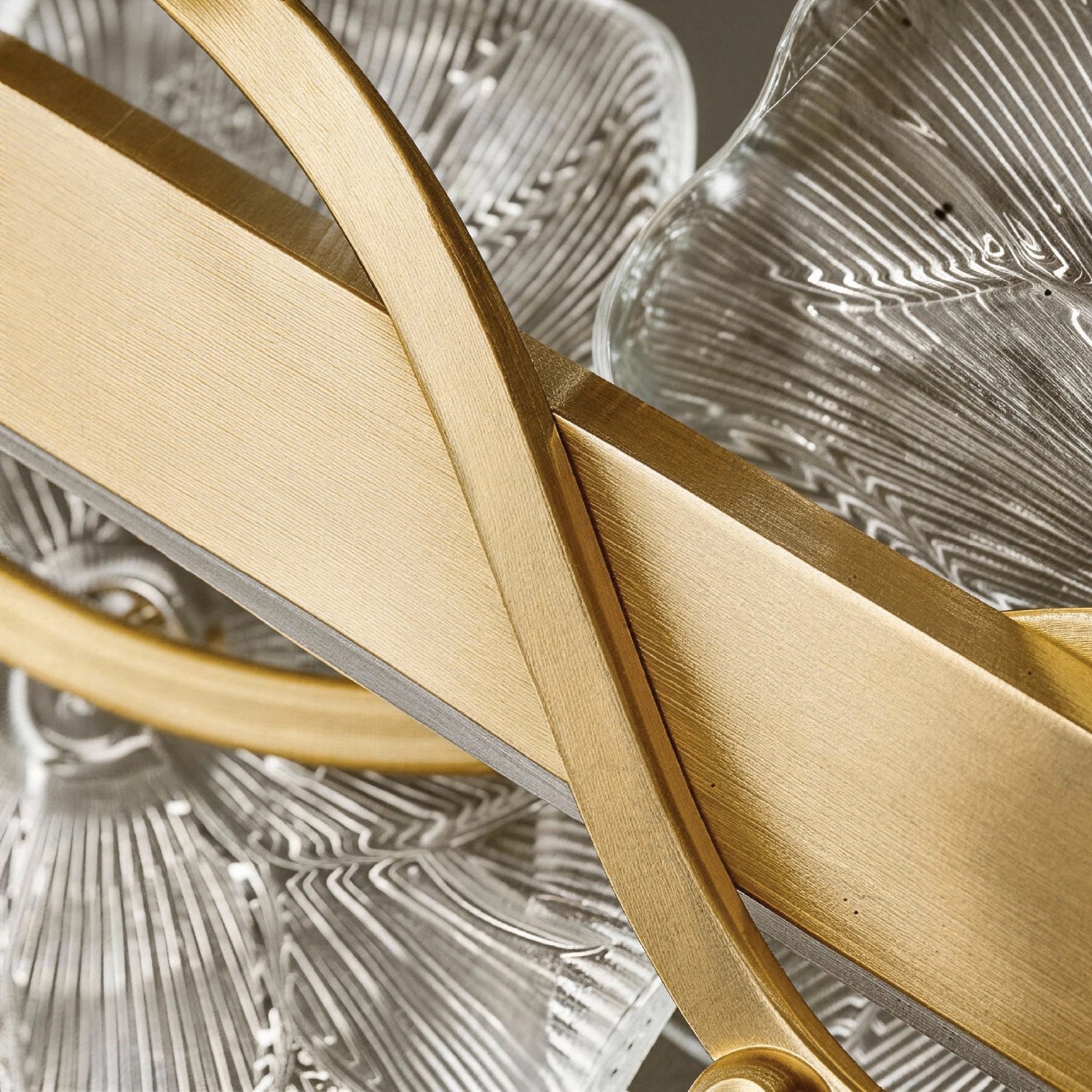Close-up detail of the Contemporary Linear Glass Flower Chandelier petals, showcasing the ribbed, translucent glass and gold hardware. Sofary Lighting