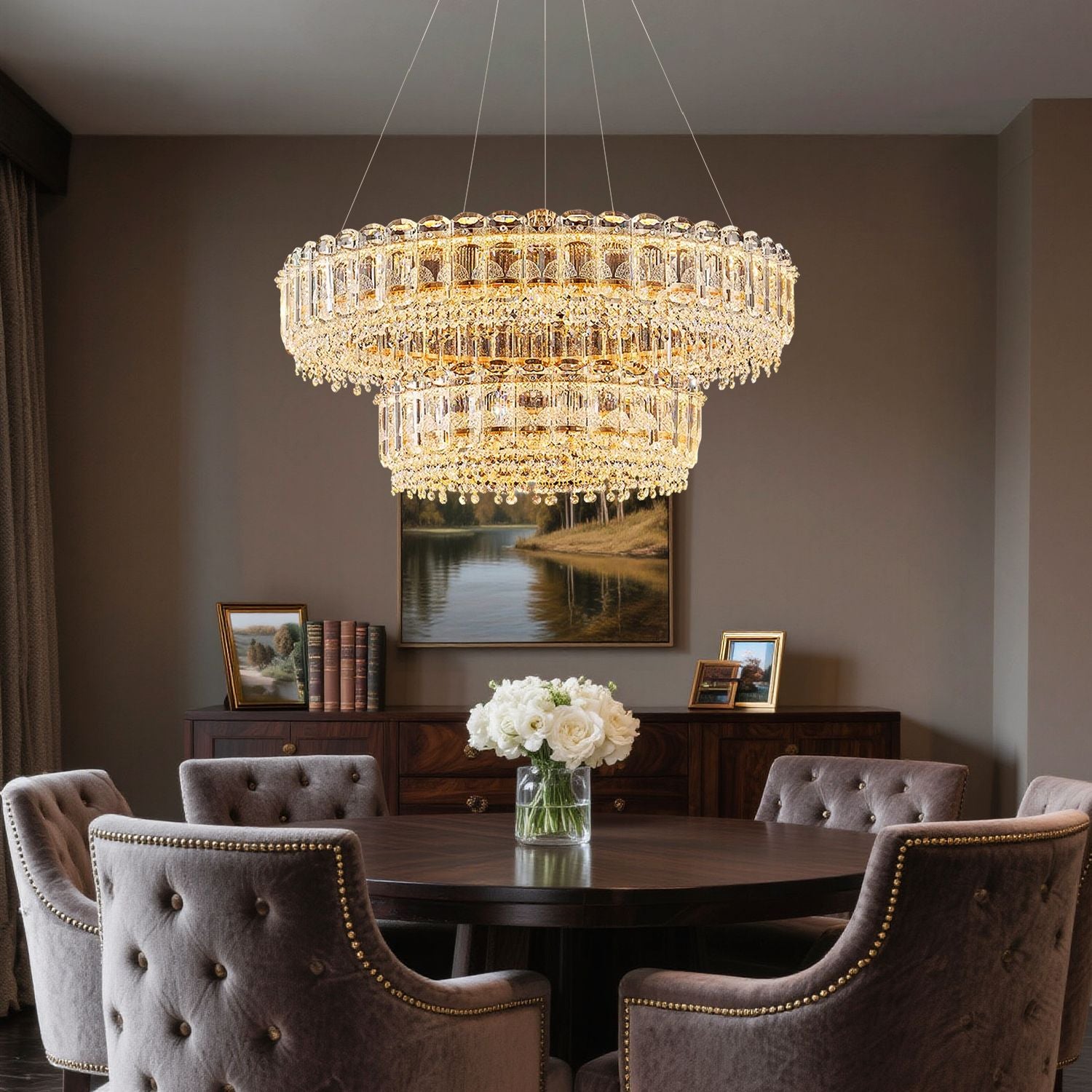 Empire Modern Luxury Gold K9 Crystal Double Tiered Three-Color Dimming Chandelier illuminates a sophisticated dining room with warm, adjustable light, enhancing the elegance of a round table, velvet chairs, and floral centerpiece