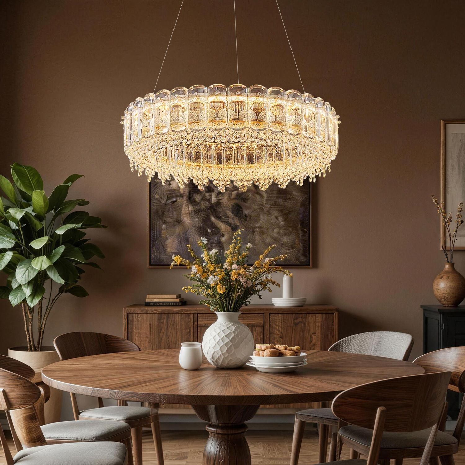 Empire Modern Minimalist Gold K9 Crystal Single Tiered Three-Color Dimming Chandelier casting warm, layered glow over a formal dining table set for dinner — perfect for evening entertaining | Sofary Lighting