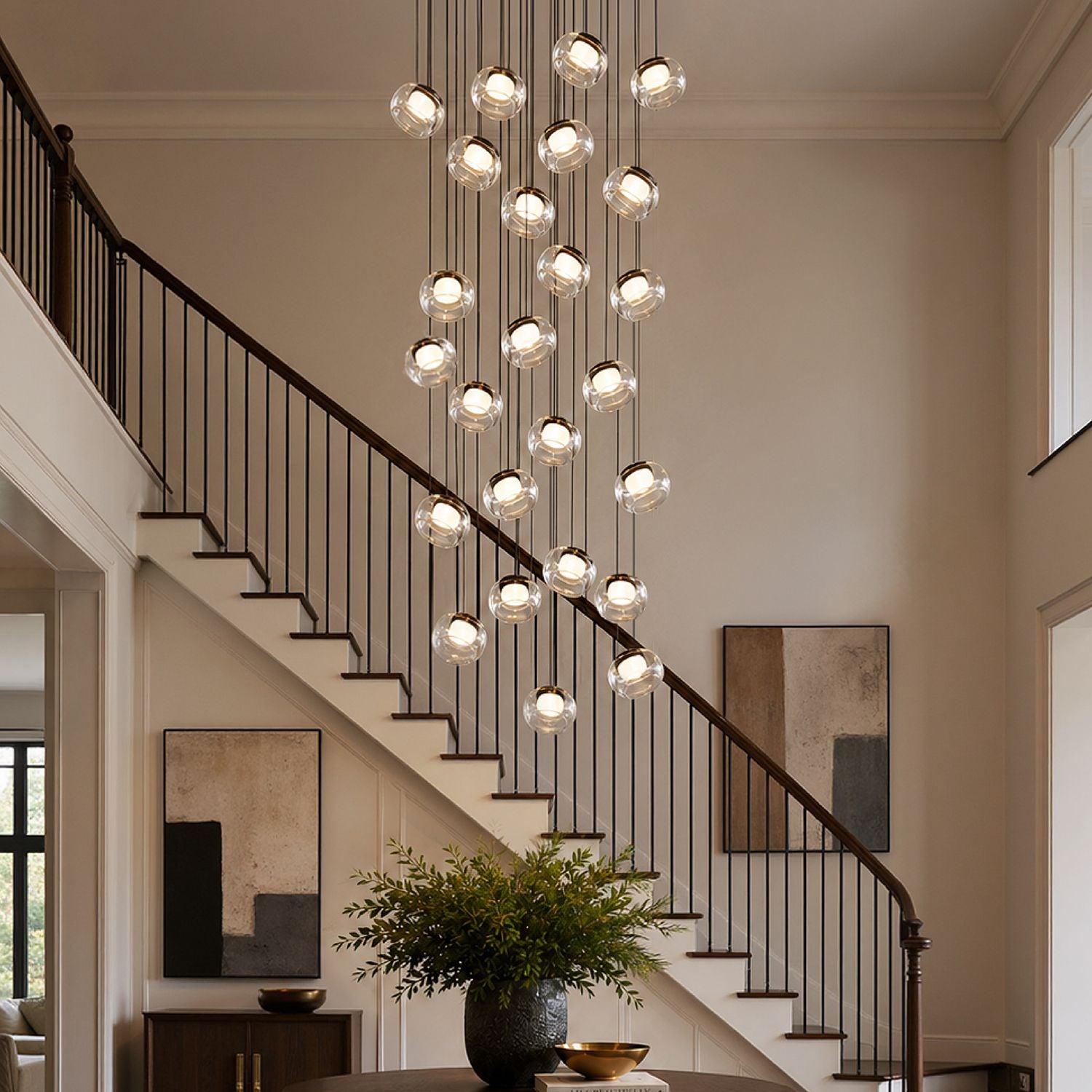 Etherea Modern Cascading Glass Globe Chandelier — multiple transparent glass orbs on thin black cables, minimalist design with warm glowing illumination against a black background | Sofary Lighting