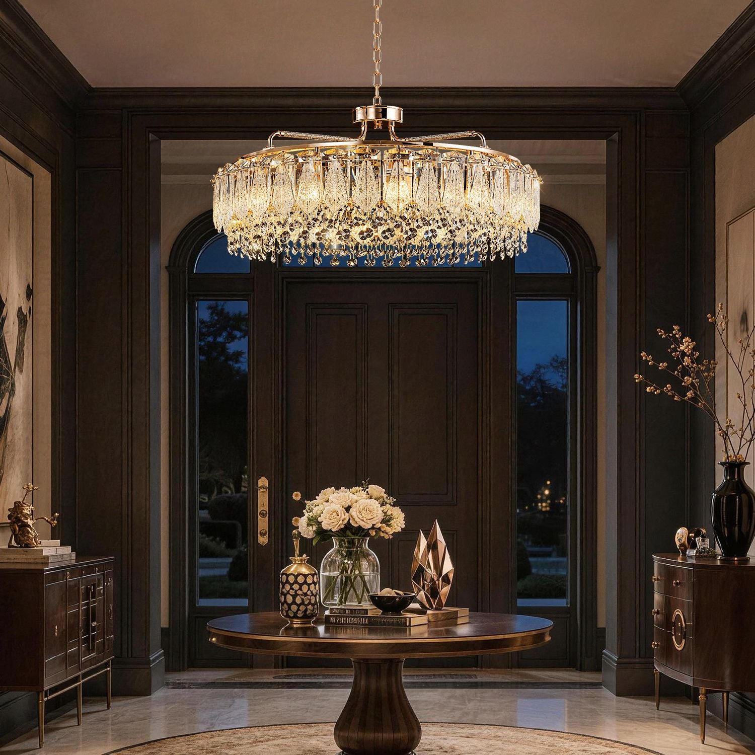 Glacier Modern Luxury Ice-Cracked Crystal Ring Chandelier in a foyer — displayed above a round wooden console table with floral arrangements and decorative sculptures, against dark wood paneling | Sofary Lighting