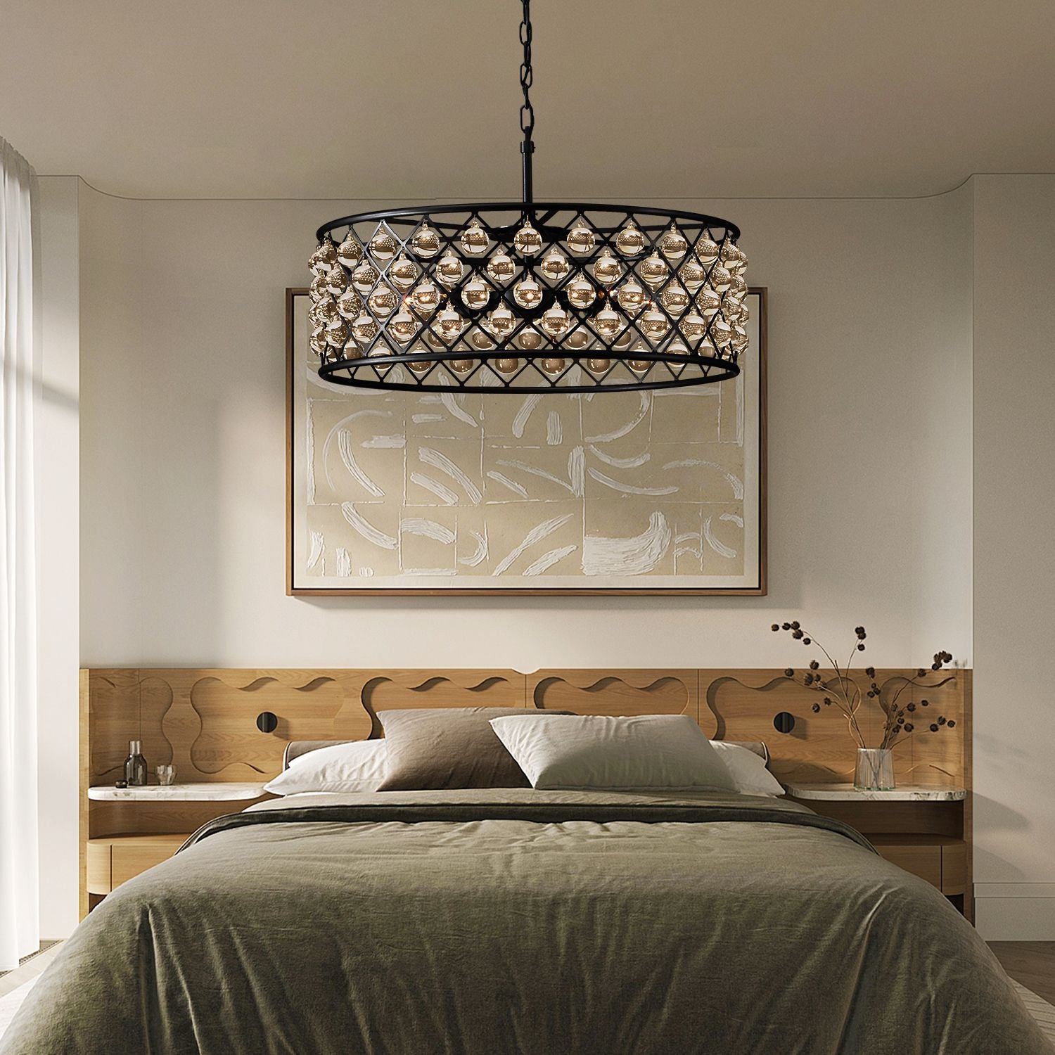 Harlow Vintage Matte Black K9 Crystal Round Chandelier in a bedroom — hanging above a wooden bed with layered bedding, nightstands, and a large abstract art backdrop | Sofary Lighting