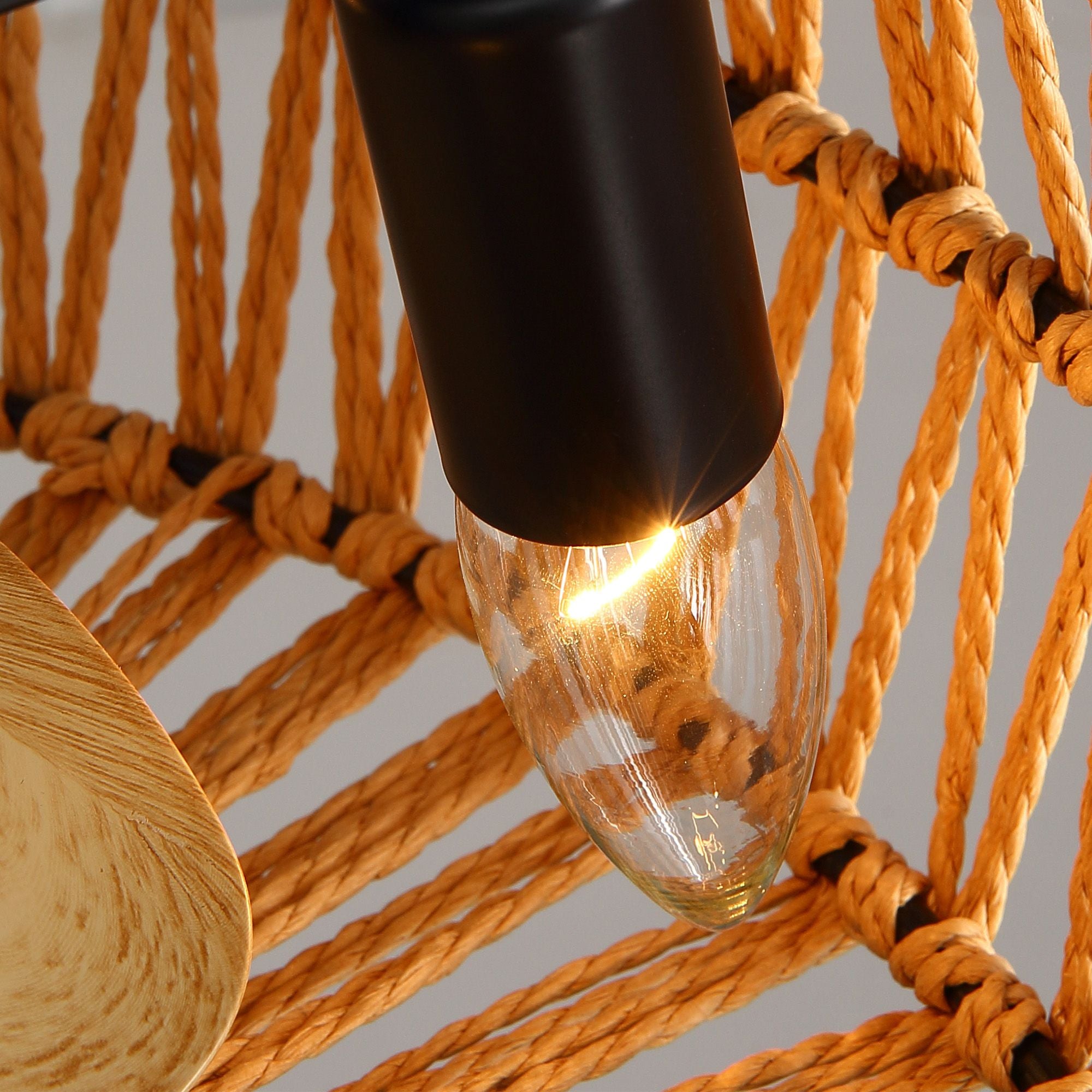 Haven Ceiling Fan light bulb detail — matte black socket, warm filament glow through woven shade, rustic modern accent | Sofary Lighting