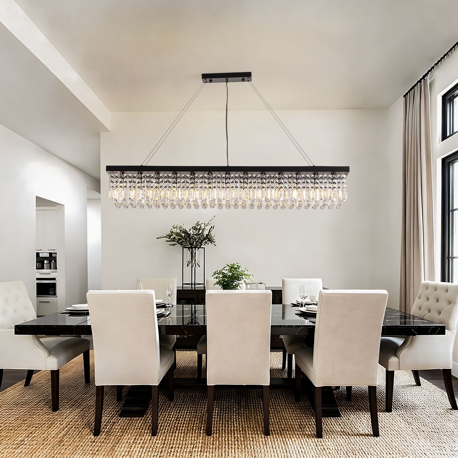 Matrix Linear Chandelier in a bright dining room — black frame, crystal droplets, and symmetrical layout with abstract wall art and linen drapes | Sofary Lighting