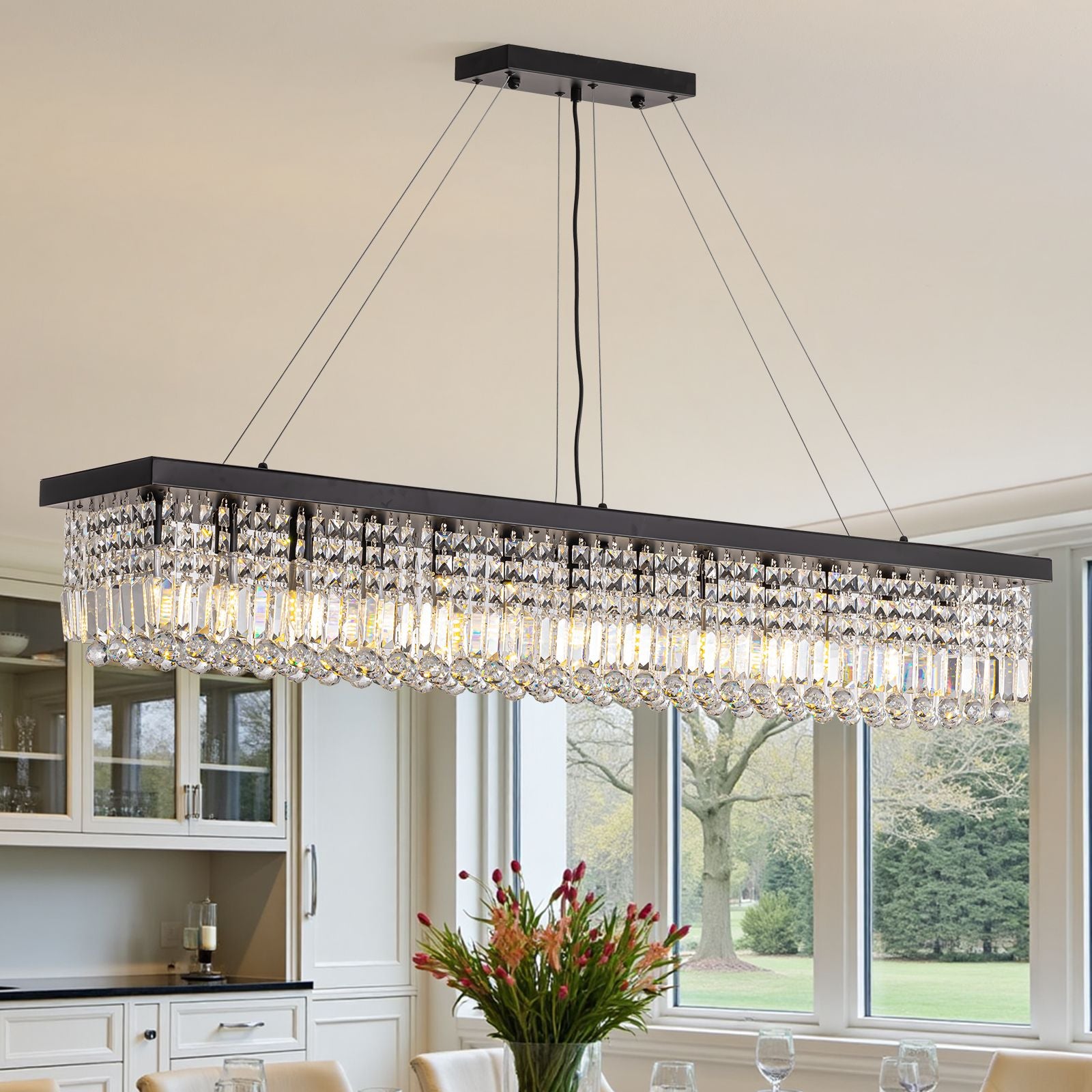 Matrix Linear Chandelier styled with floral centerpiece — elegant dining setup with white tufted chairs, marble table, and natural light from large windows | Sofary Lighting