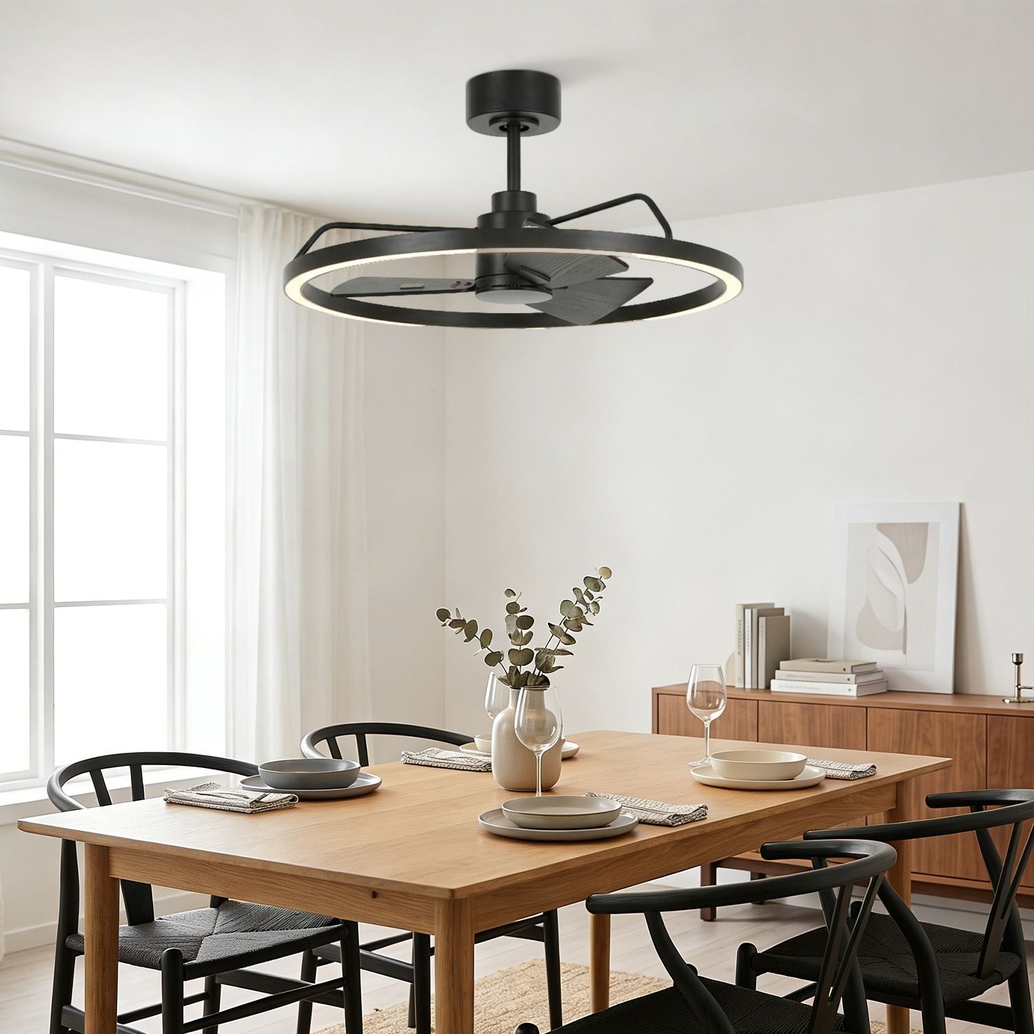 modern black ceiling fan with led ring light installed above dining table