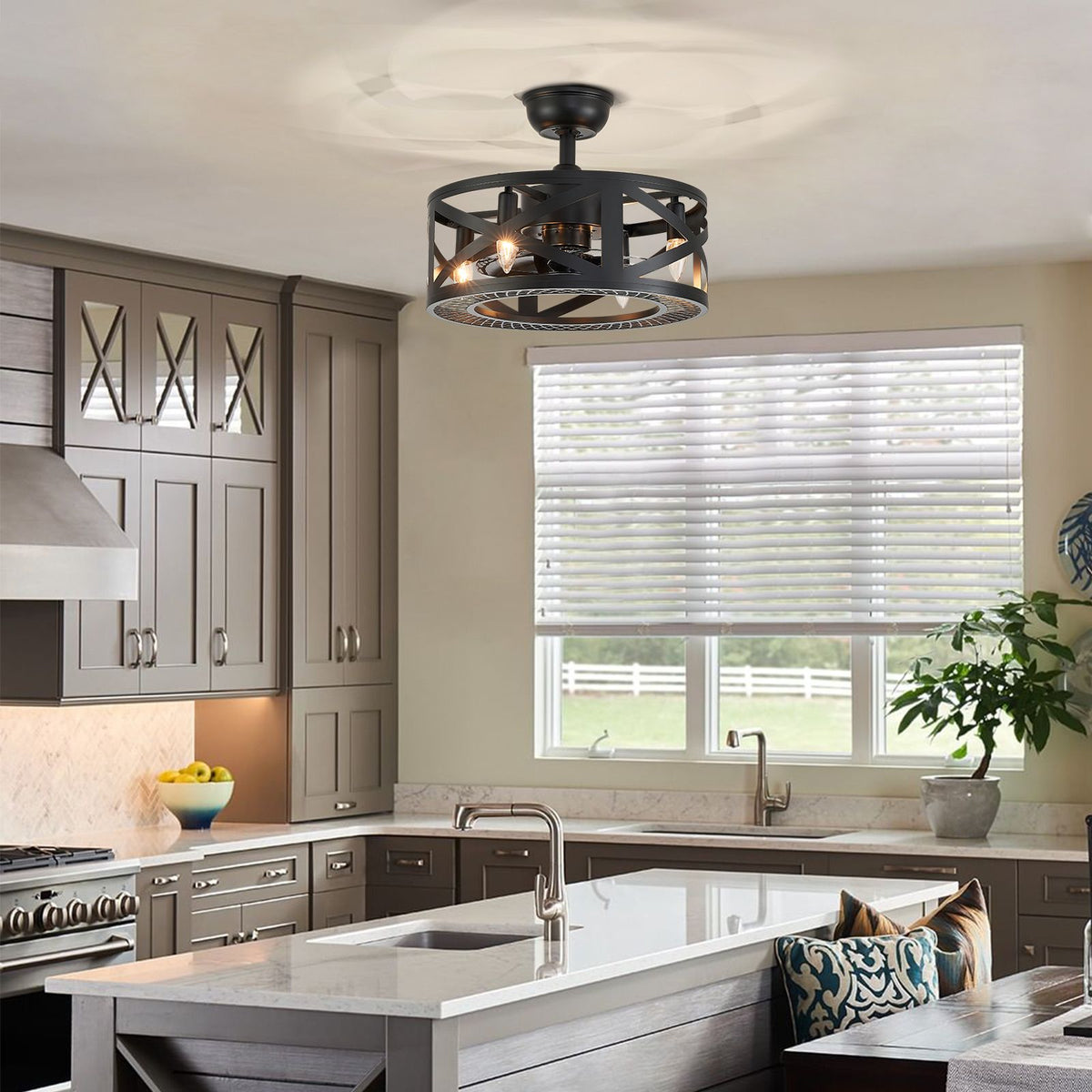 Industrial caged fan over kitchen island — gray cabinetry, white countertop, window blinds, greenery, modern farmhouse kitchen | Sofary Lighting