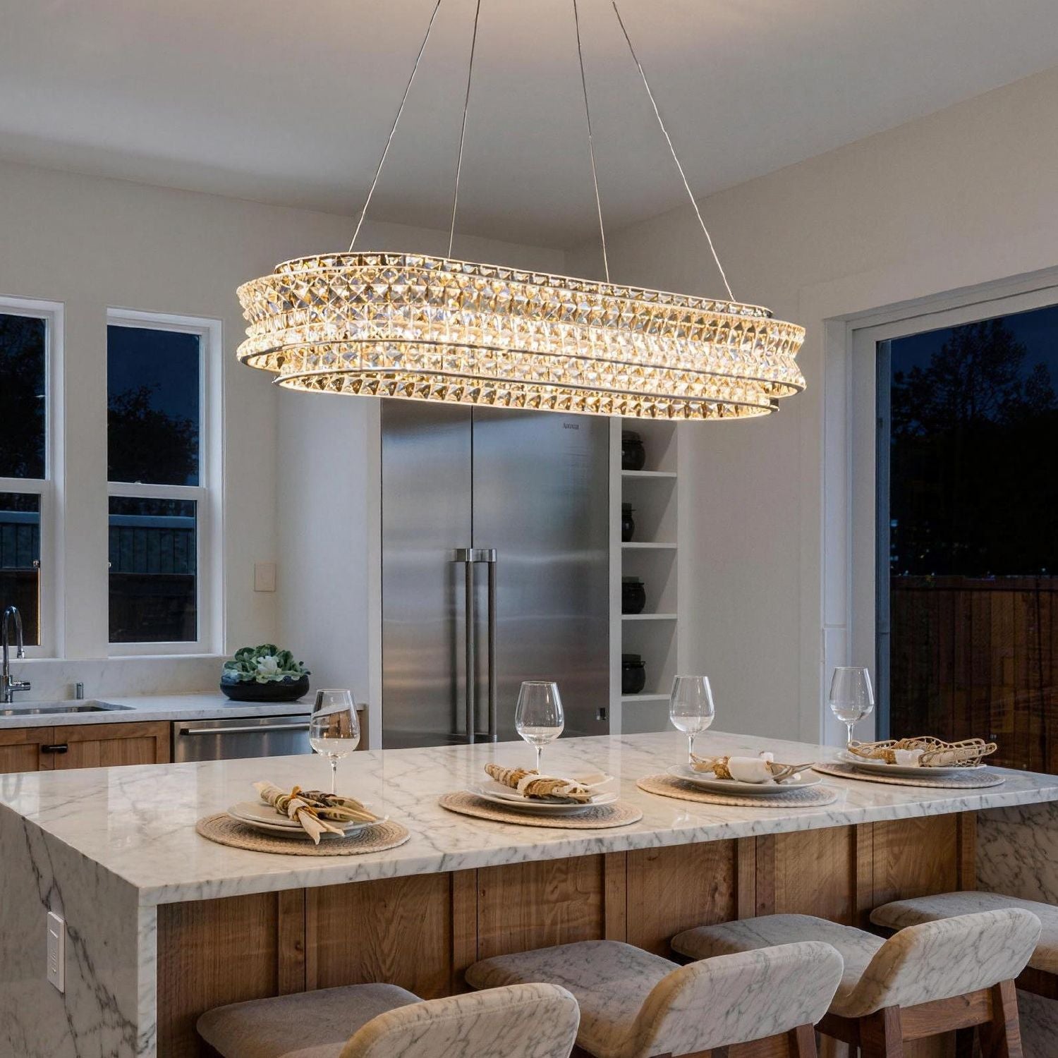 modern champagne gold k9 crystal chandelier over kitchen island providing bright modern lighting | Sofary Lighting