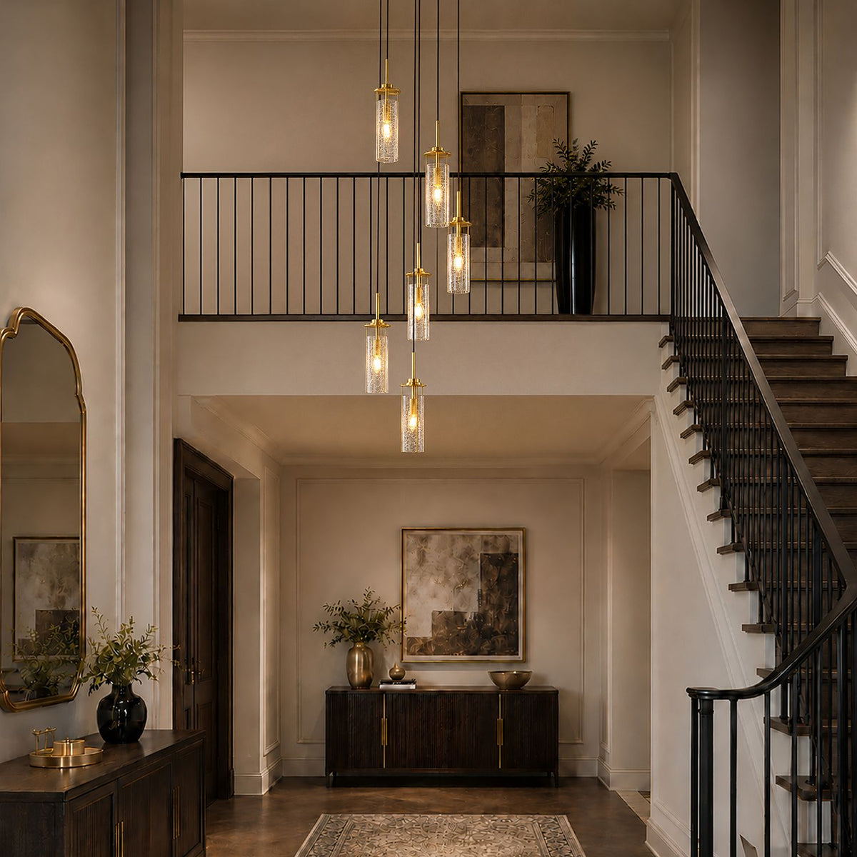 Novera Chandelier suspended over staircase — black wrought iron railing, double-height ceiling, natural light — enhances vertical drama and sophistication | Sofary Lighting