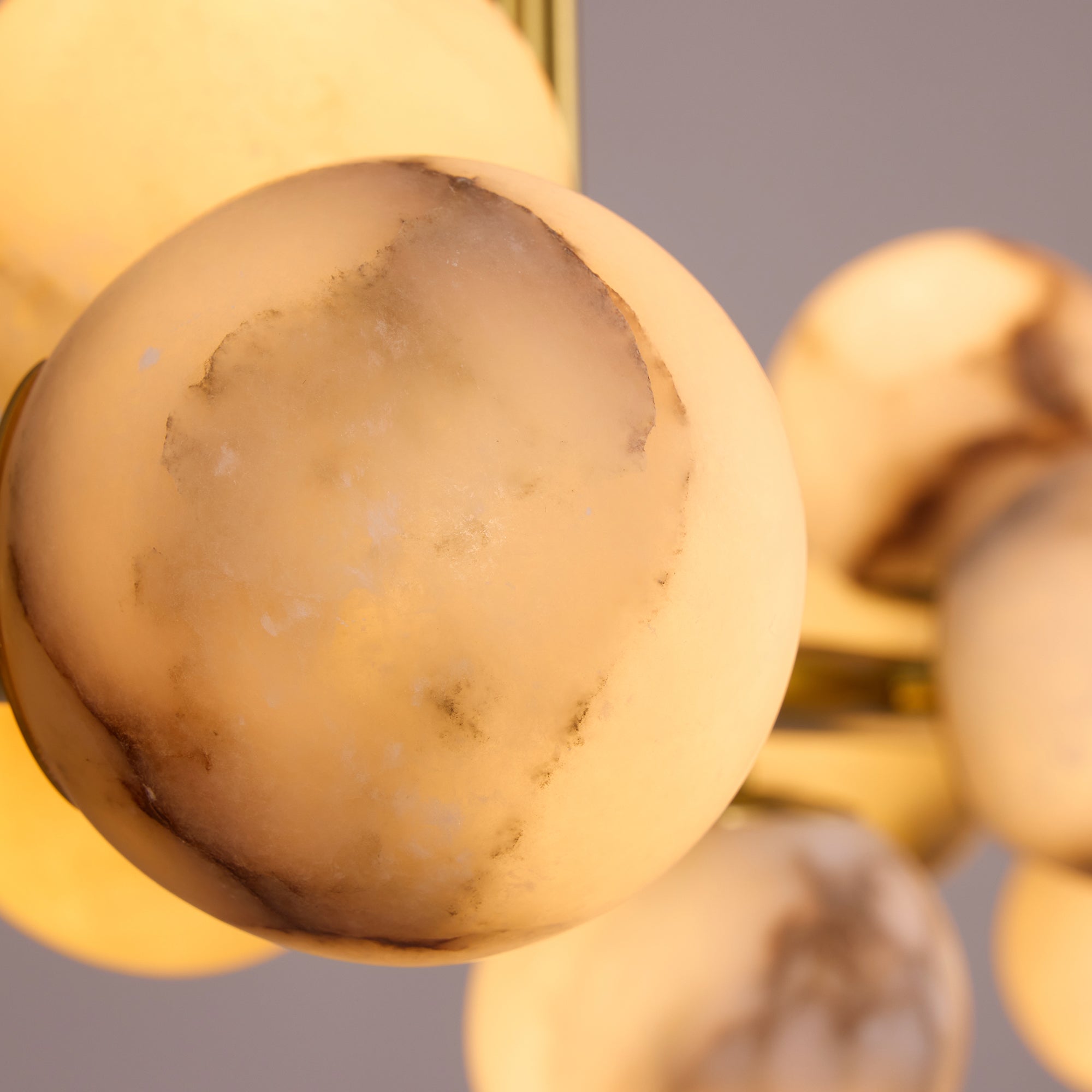 orbelia modern luxury gold alabaster globe linear chandelier glowing alabaster globe detail