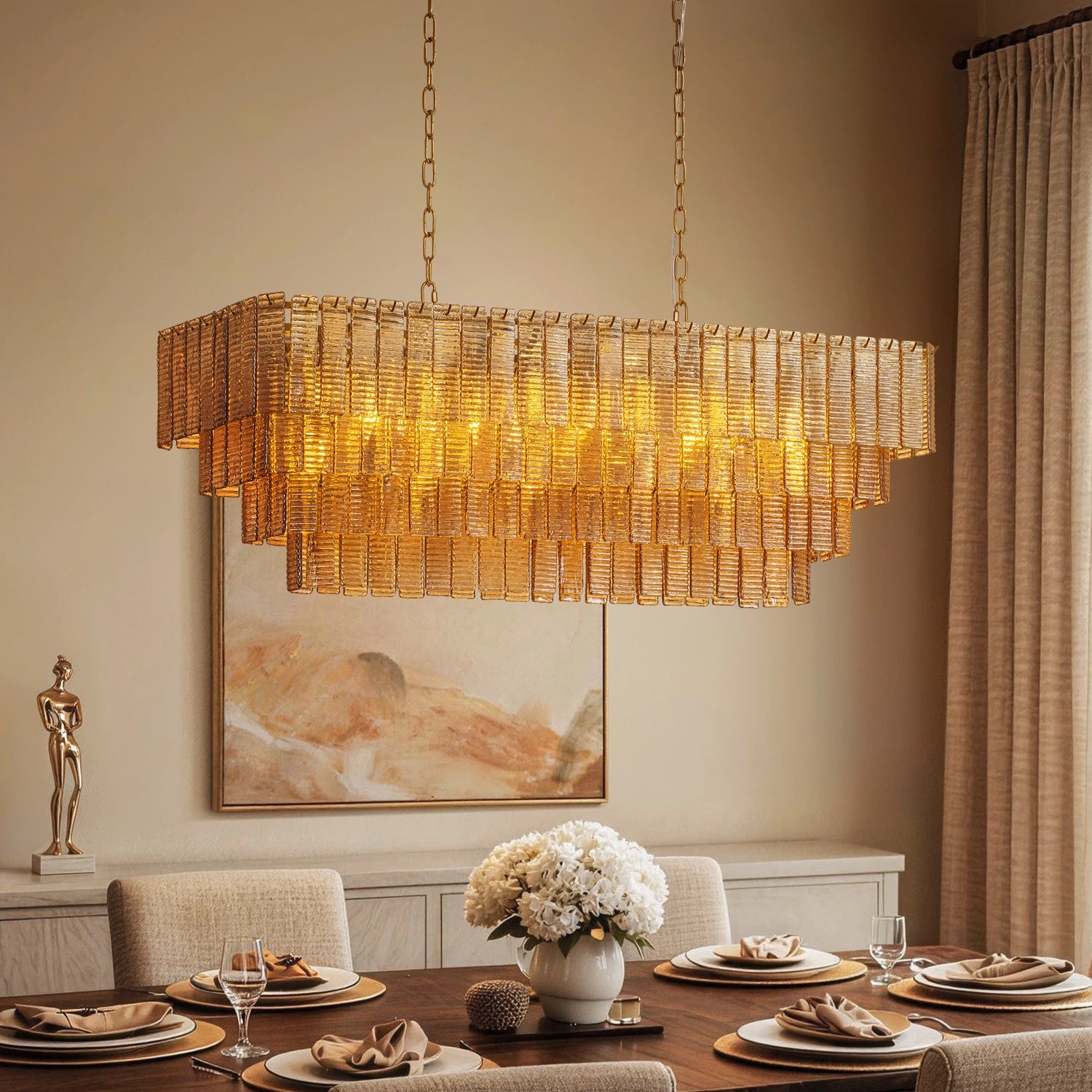 Rectangular amber ribbed glass chandelier in a bright, modern dining room with beige walls and minimalist decor. Sofary Lighiting