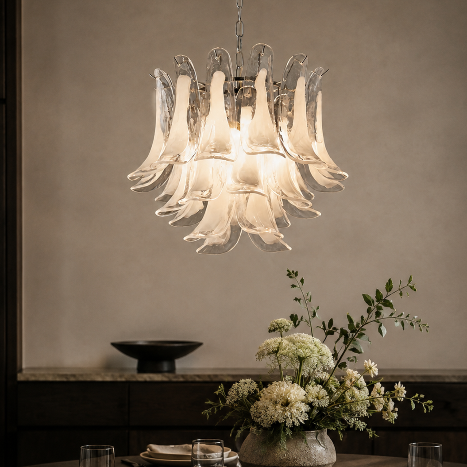 Veloria silver hand-formed glass petal chandelier in a dining room close-up