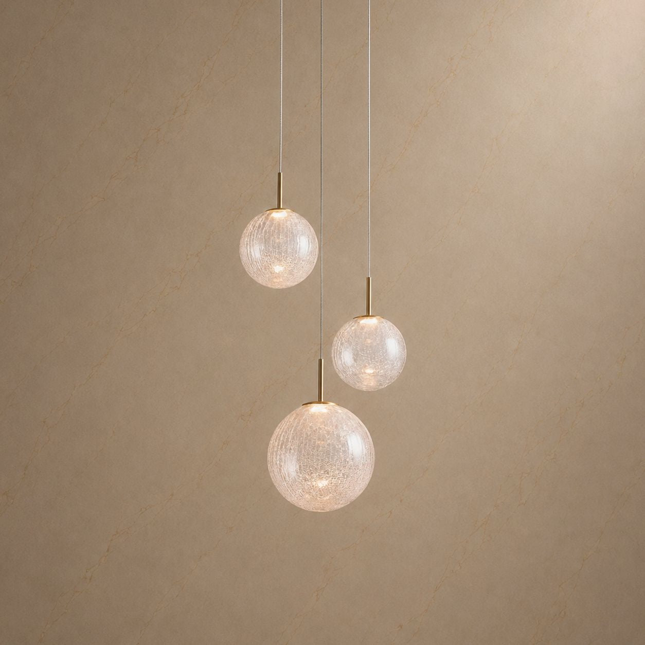 Veritas 3-Light Sculptural Chandelier — three textured glass globes in cascading arrangement, warm ambient glow, brass fixtures, perfect for small foyers and intimate spaces | Sofary Lighting