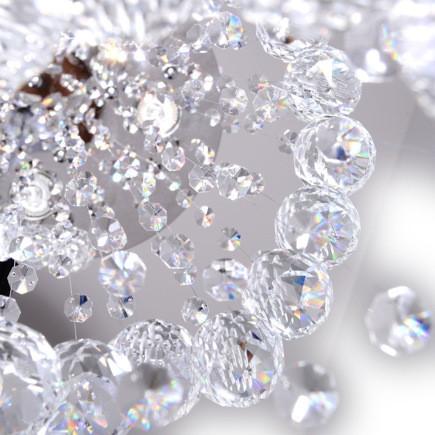 detailed view of crystal strands and faceted k9 crystals forming double spiral chandelier structure | Sofary